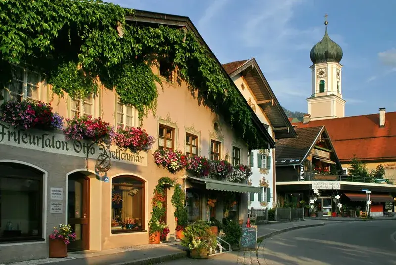 Ornate Alpine house facades and an onion dome church 